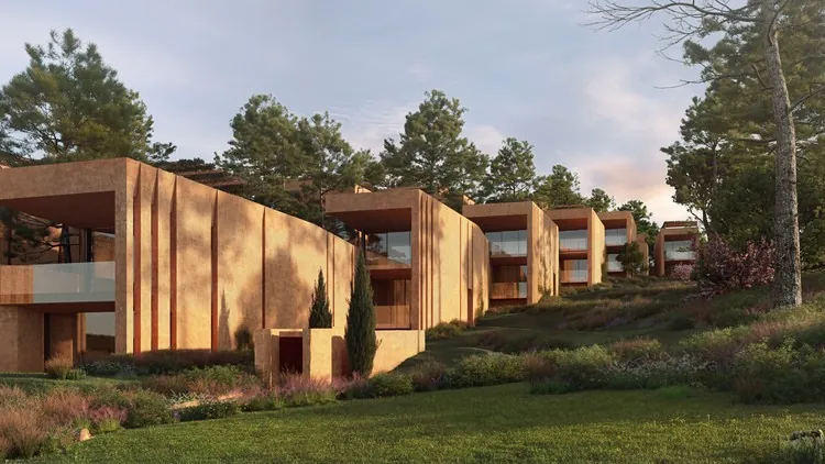 Render de villas Palmares Ocean Living: tres volúmenes paralelos con paredes de hormigón visto en tono rojo cálido, cubiertas planas y aperturas vidriadas hacia el paisaje boscoso, vegetación silvestre alrededor